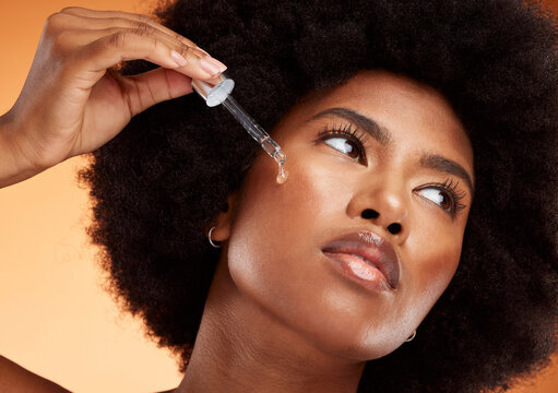 Beauty customer applying serum